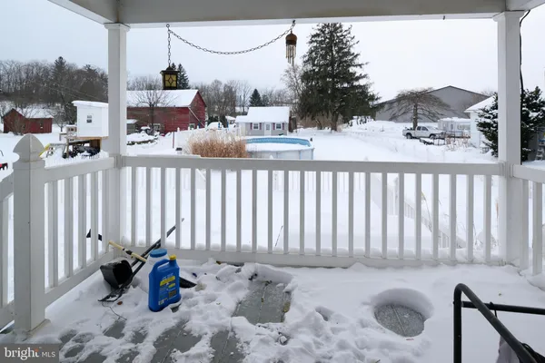 a view of a house with wooden fence