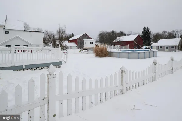 a view of a swimming pool with a yard