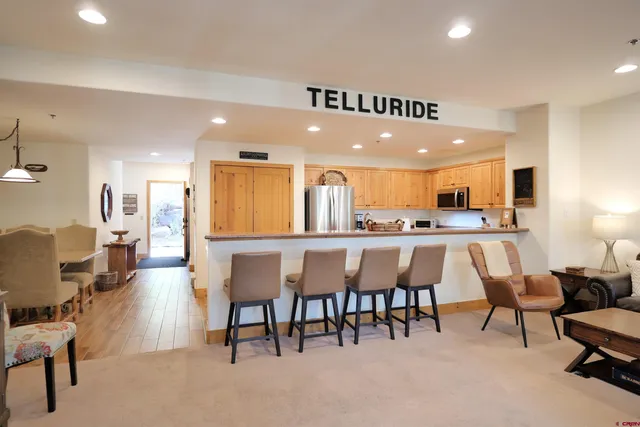 a white bath tub sitting next to a shower