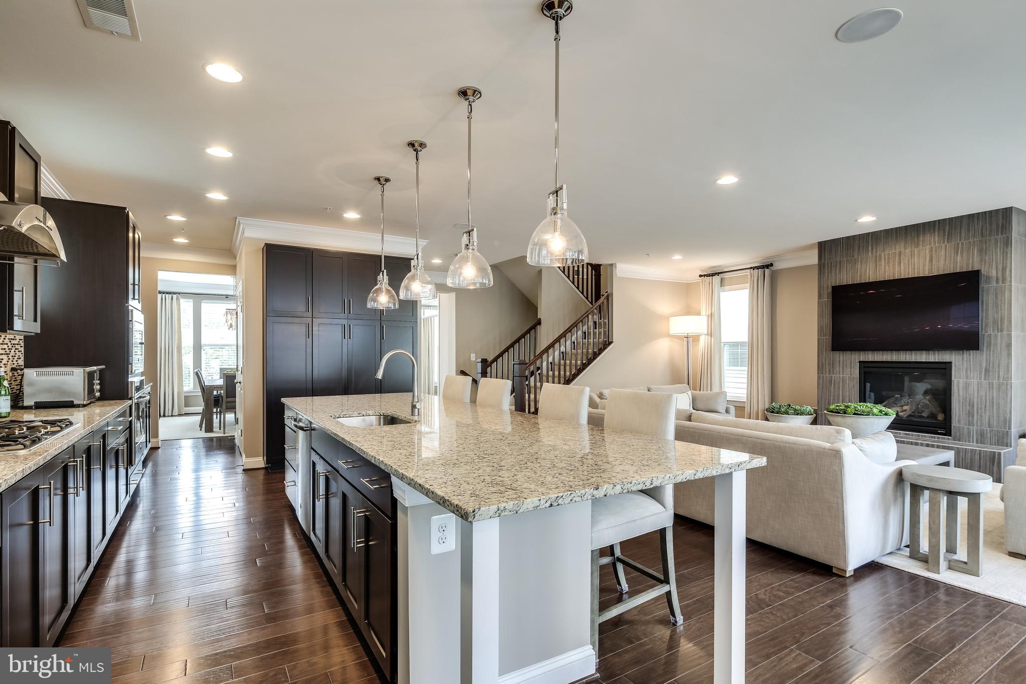 7771 Elmwood Road Fulton, MD 20759 - Photo 12 of 59 Kitchen with espresso cabinetry & granite counters