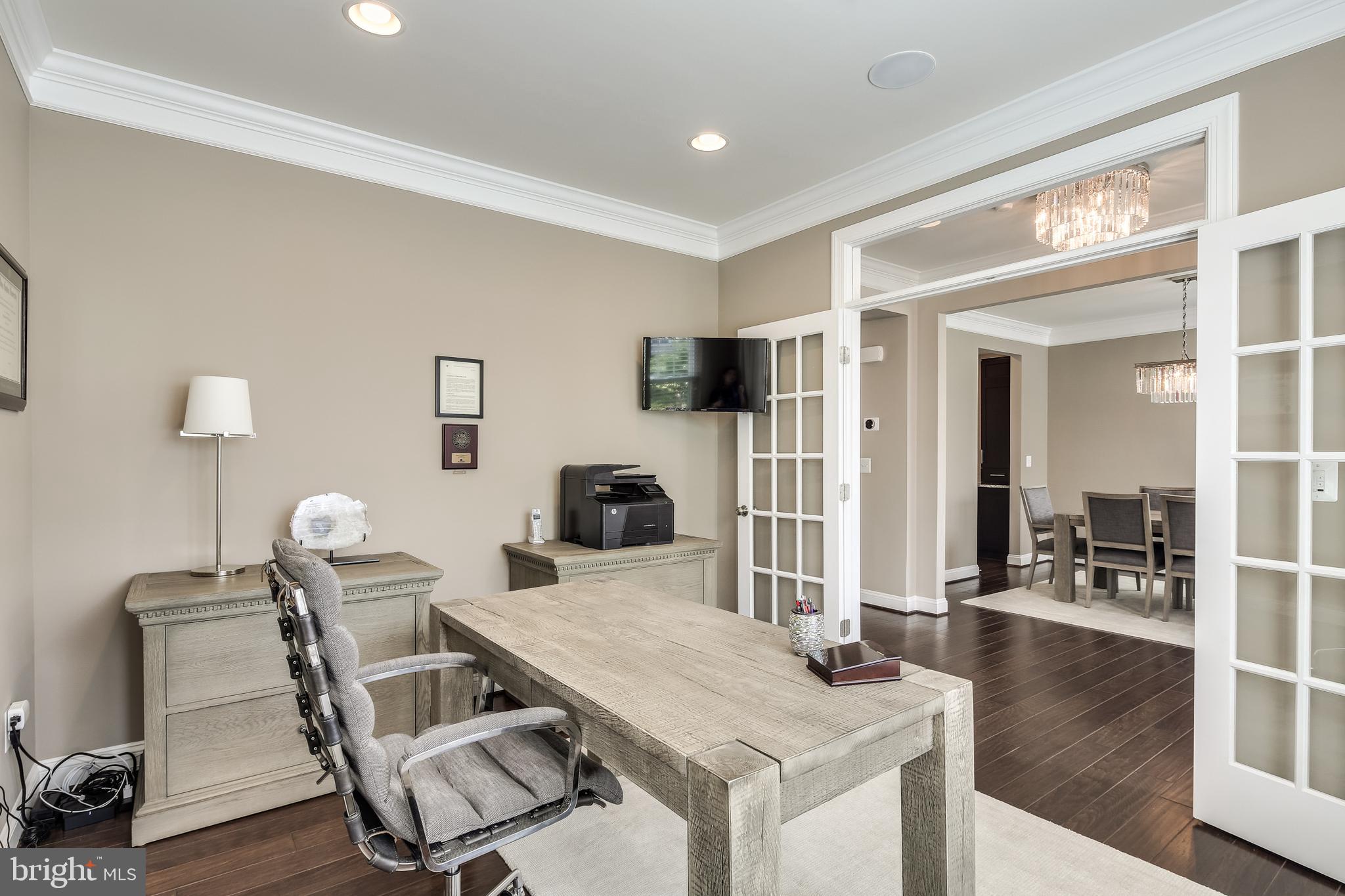 French doors lead to main level study/library
