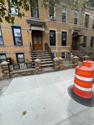 a front view of house with outdoor seating