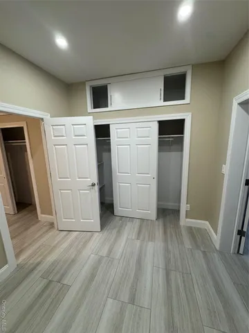 a view of a livingroom with wooden floor
