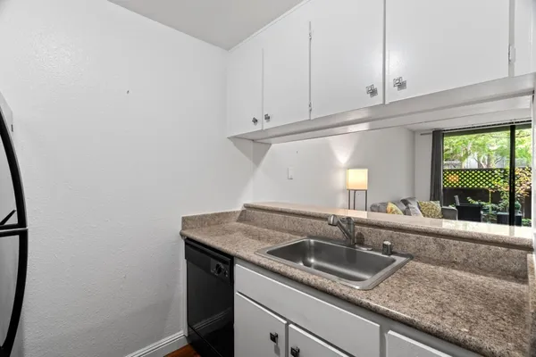 a kitchen with a sink and a window