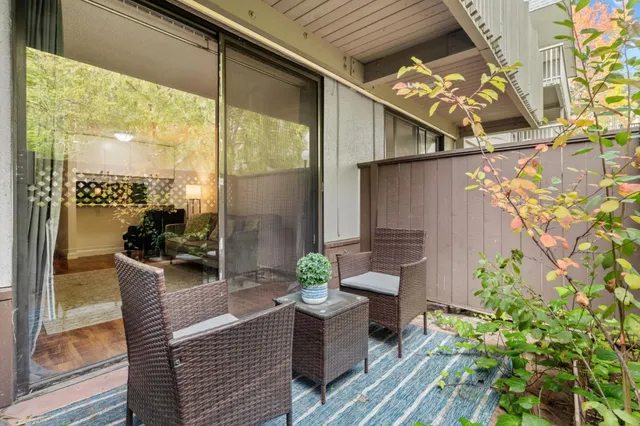 a view of balcony with furniture
