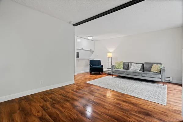 a living room with a couch and a fireplace
