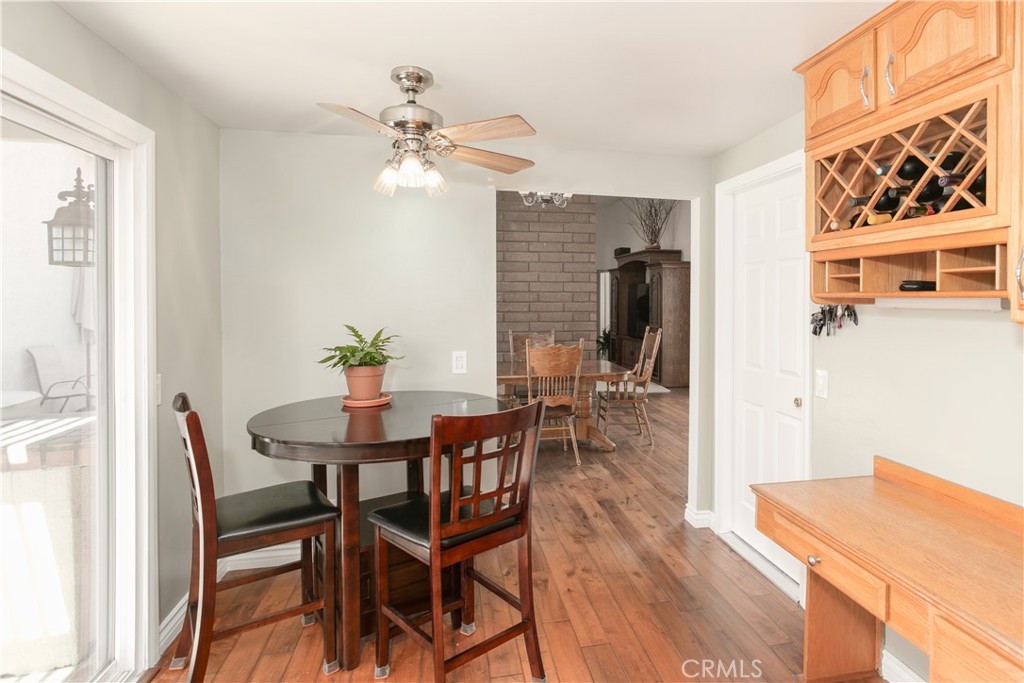 14302 Morning Glory Road Tustin, CA 92780 - Photo 13 of 38 a view of a dining room with furniture and wooden floor
