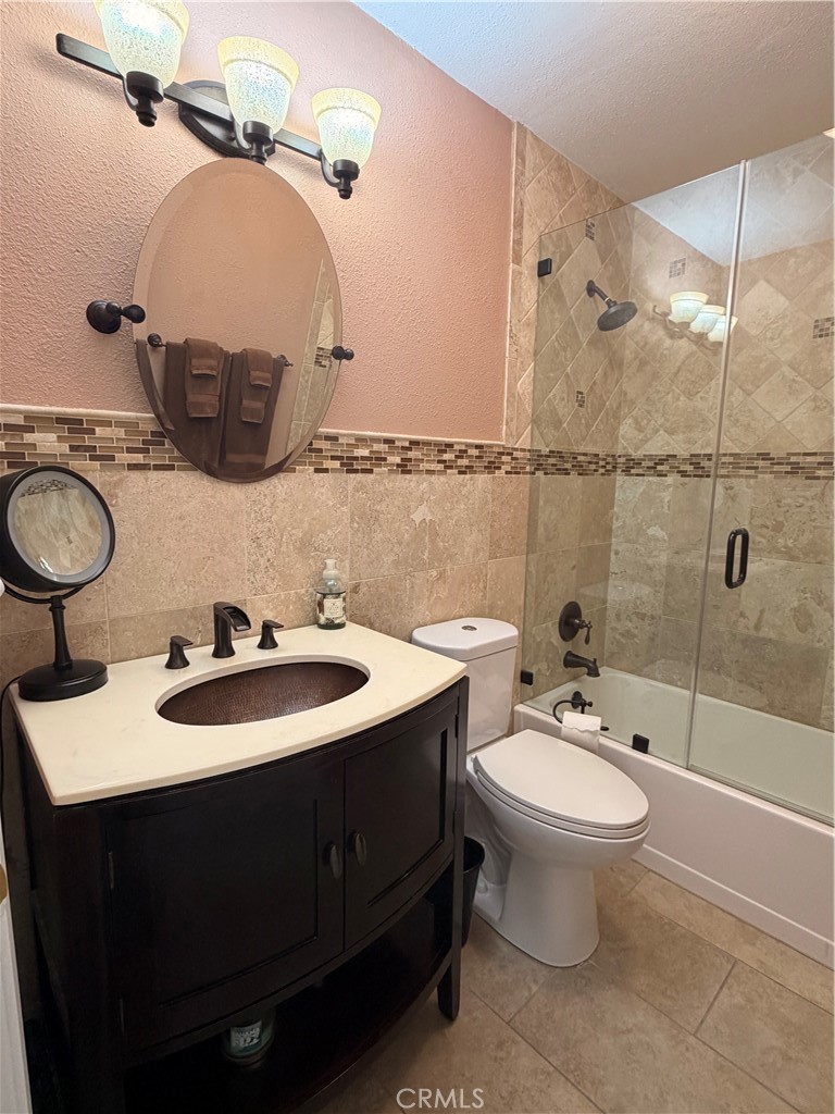 14302 Morning Glory Road Tustin, CA 92780 - Photo 18 of 38 a bathroom with a sink toilet and shower