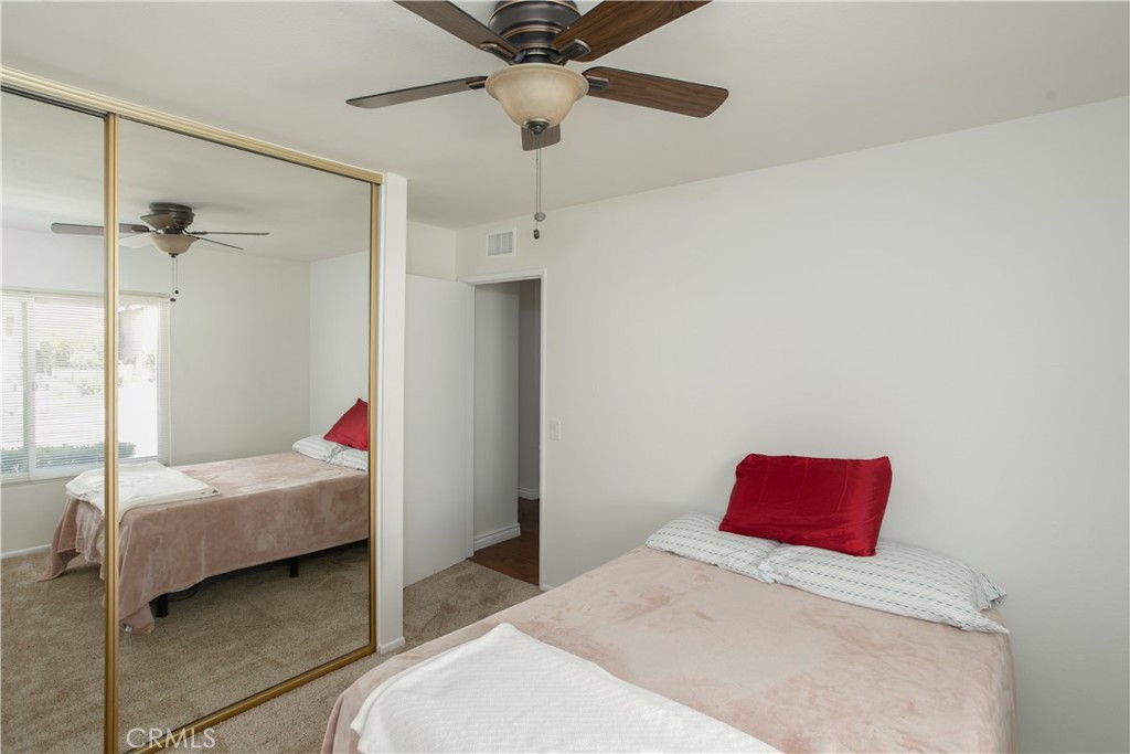14302 Morning Glory Road Tustin, CA 92780 - Photo 20 of 38 a bedroom with a bed and a ceiling fan
