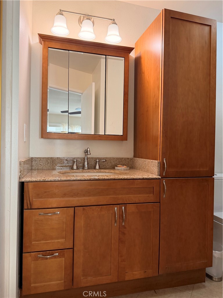14302 Morning Glory Road Tustin, CA 92780 - Photo 23 of 38 a bathroom with a sink and a mirror