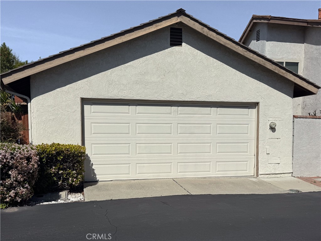 14302 Morning Glory Road Tustin, CA 92780 - Photo 31 of 38 a side view of a house with a garage