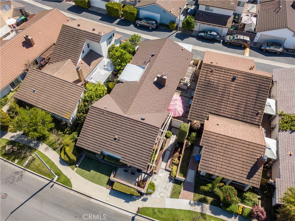 14302 Morning Glory Road Tustin, CA 92780 - Photo 33 of 38 a view of a patio with table and chairs with wooden floor and fence