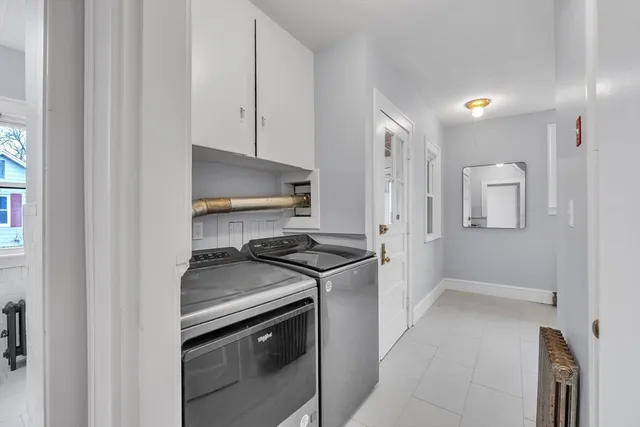 a kitchen with a stove and a refrigerator