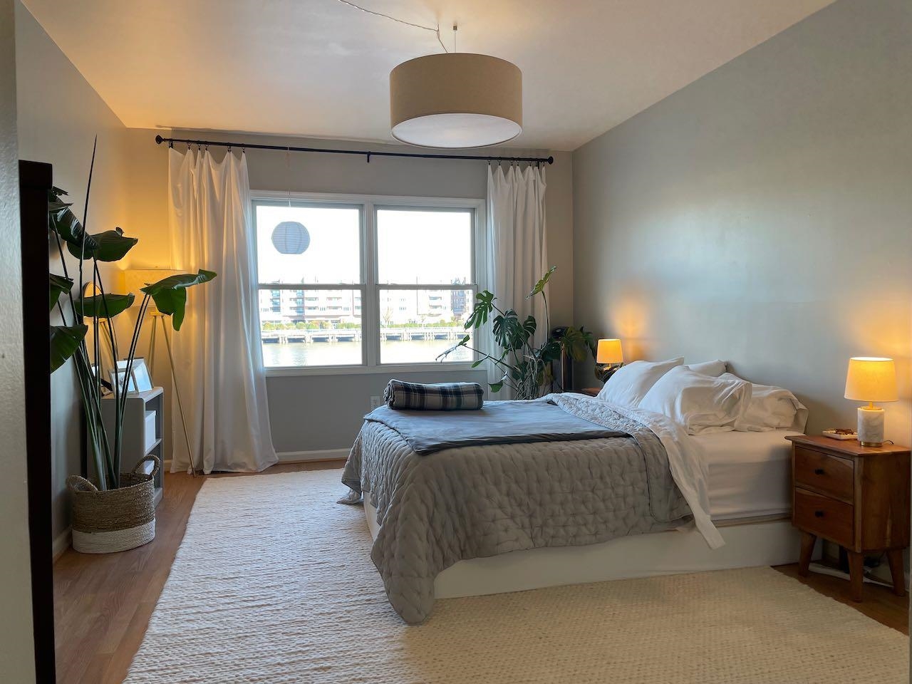 151 The Promenade Edgewater, NJ 07020 - Photo 2 of 6 a bedroom with a bed and a window