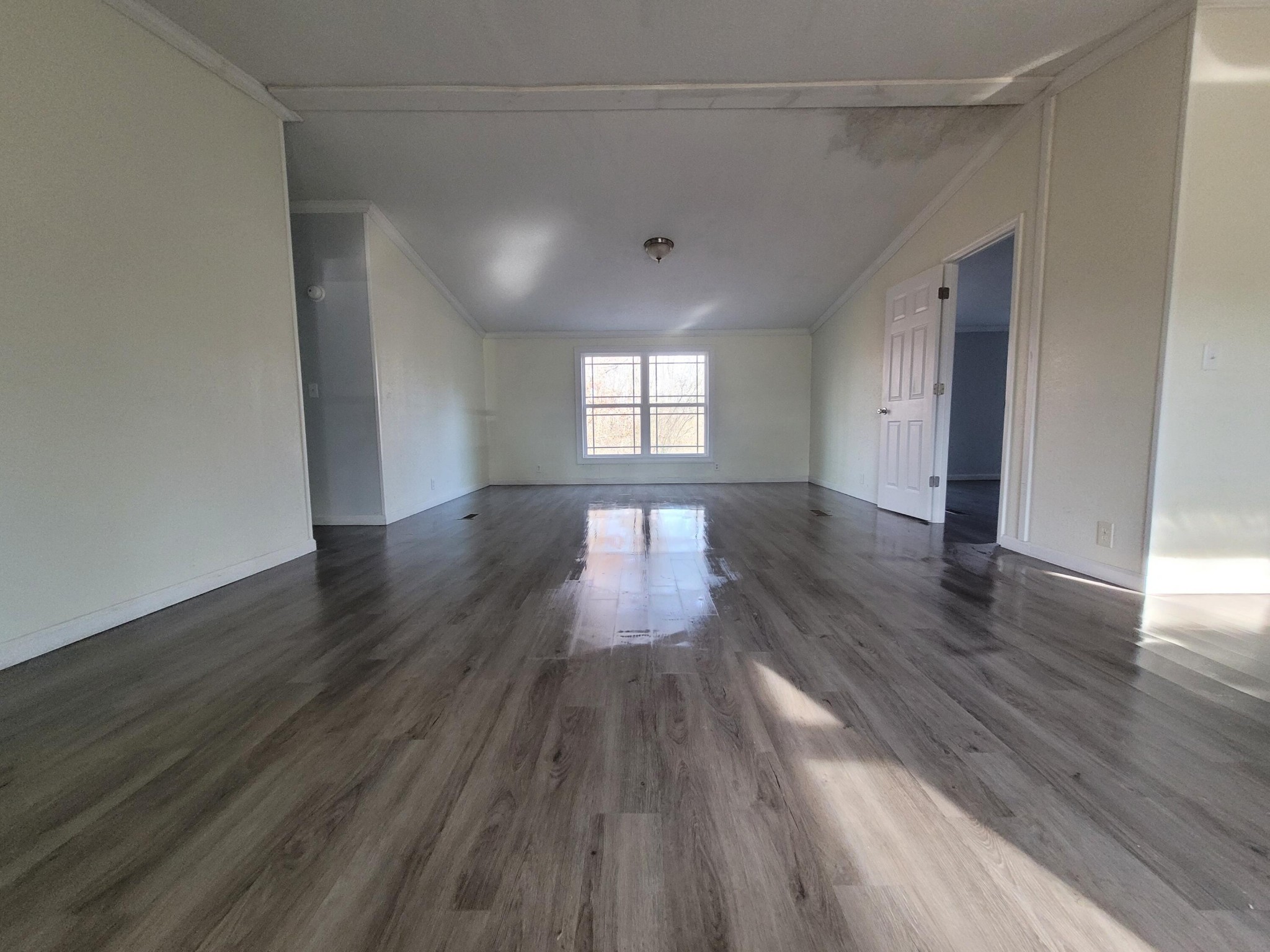 268 Ensley Road Southeast Cleveland, TN 37323 - Photo 4 of 18 wooden floor in an empty room with a window