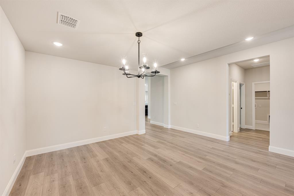 960 Imperial Eagle Road Alvarado, TX 76009 - Photo 11 of 40 wooden floor in an empty room with a window
