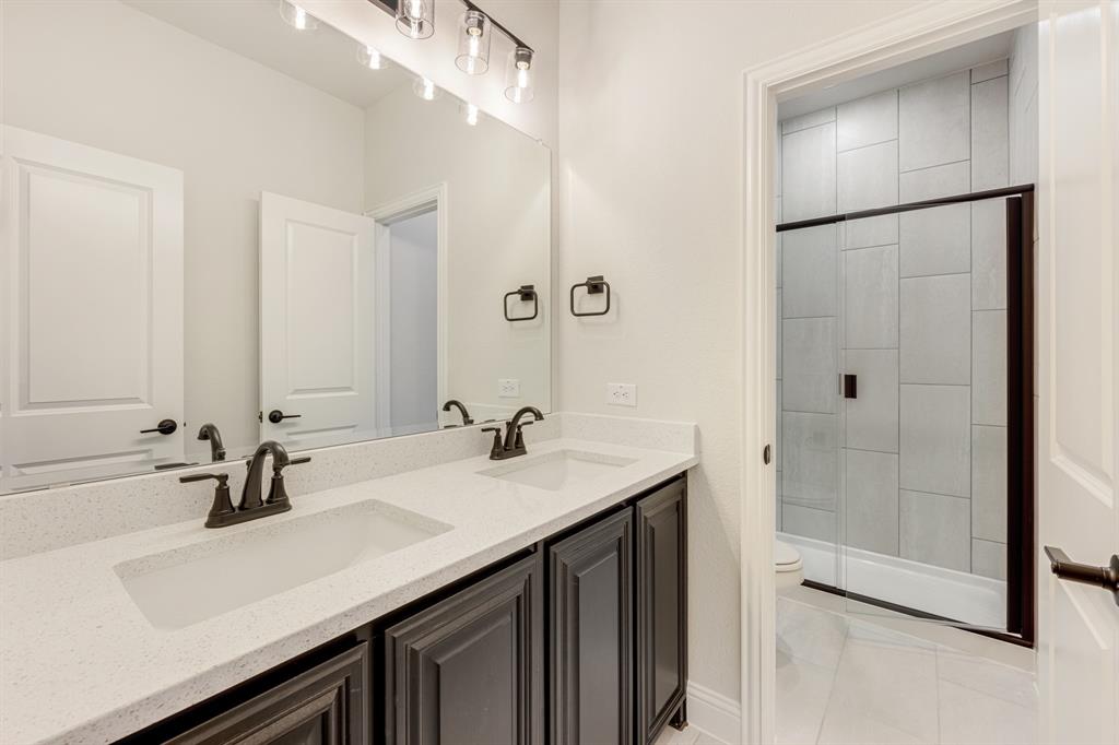 960 Imperial Eagle Road Alvarado, TX 76009 - Photo 14 of 40 a bathroom with a sink double vanity and a mirror
