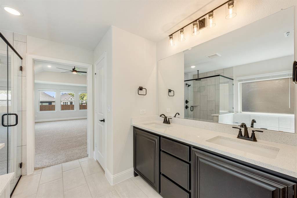 960 Imperial Eagle Road Alvarado, TX 76009 - Photo 26 of 40 a bathroom with a sink double vanity and a mirror