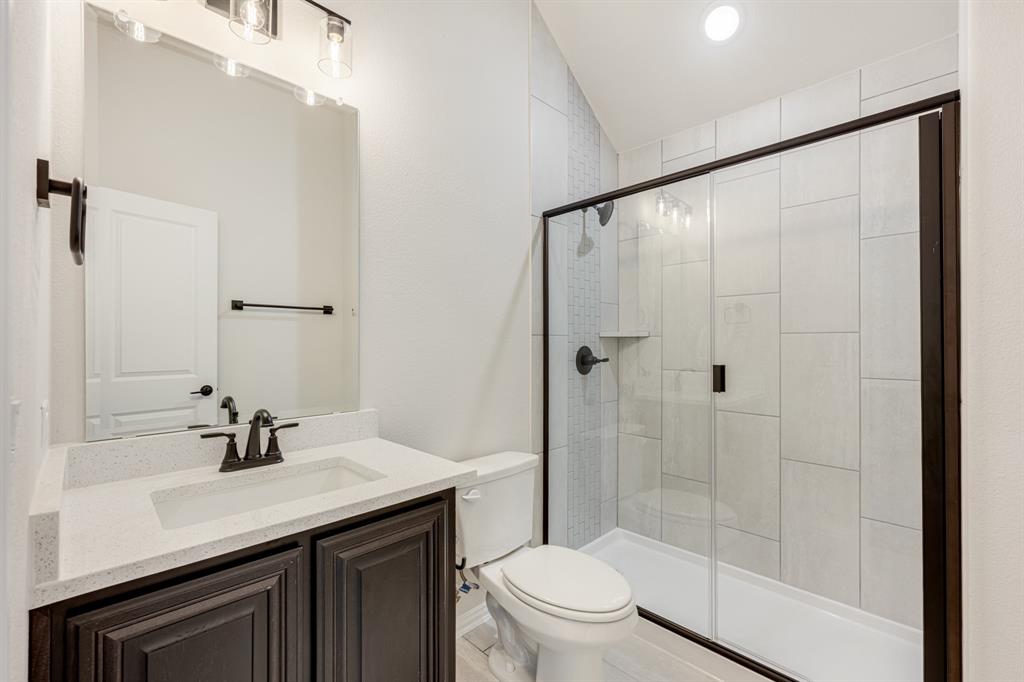 960 Imperial Eagle Road Alvarado, TX 76009 - Photo 36 of 40 a bathroom with a sink a toilet and shower