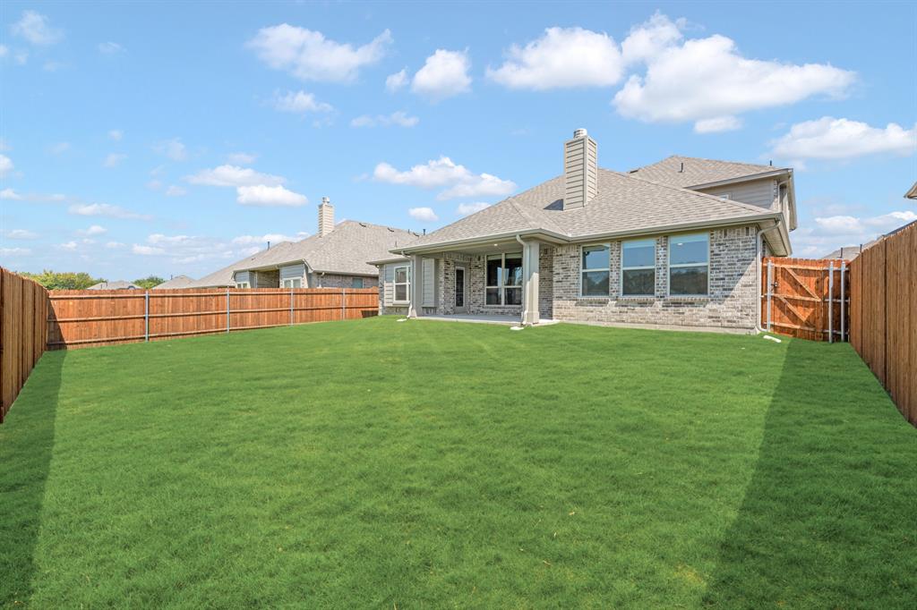 960 Imperial Eagle Road Alvarado, TX 76009 - Photo 39 of 40 a front view of a house with a yard table and chairs