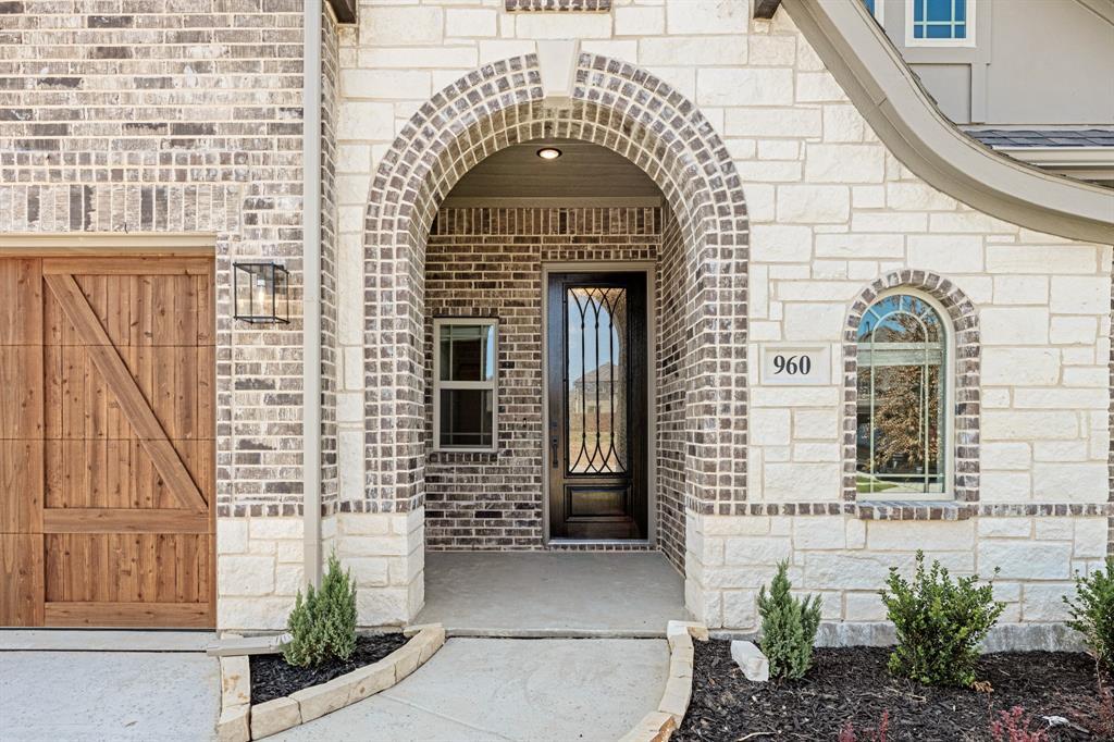 960 Imperial Eagle Road Alvarado, TX 76009 - Photo 4 of 40 a front view of a house with a garage