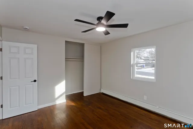 a work room with furniture and a potted plant