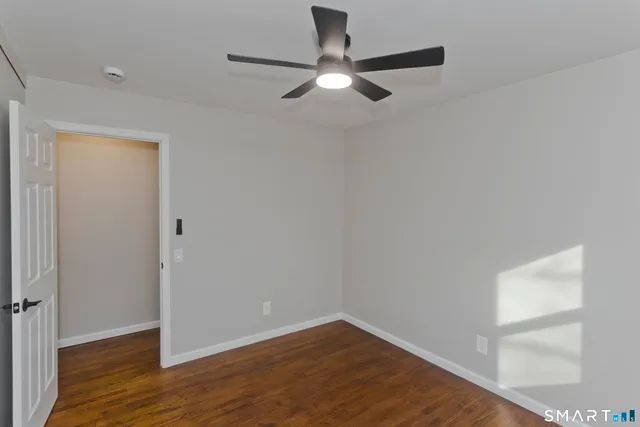 a view of wooden floor and windows in a room