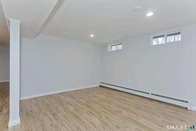 a view of hallway with wooden floor