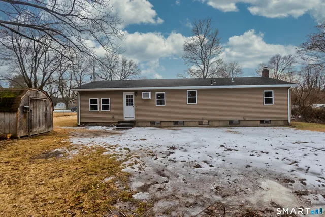 a bathroom with a toilet a sink and a mirror