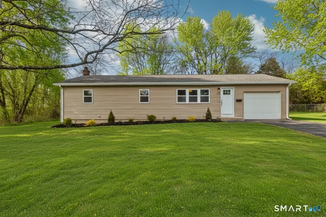 a view of a backyard with large trees