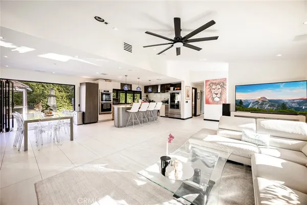 a kitchen with a sink and living room