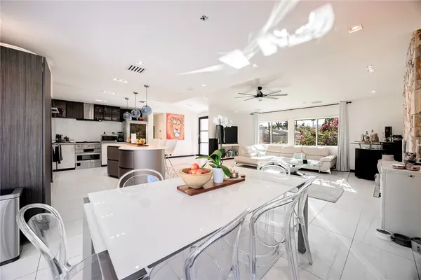 a kitchen with stainless steel appliances granite countertop a stove and a sink