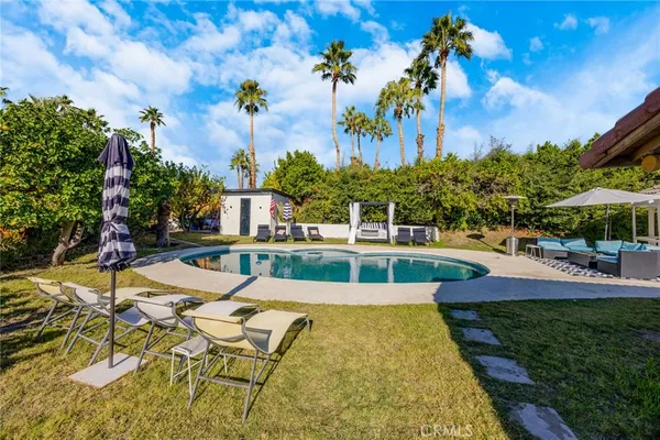 a view of a house with swimming pool