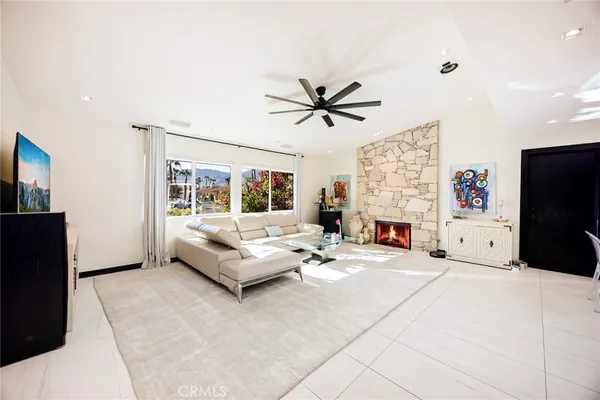 a living room with furniture and a large window