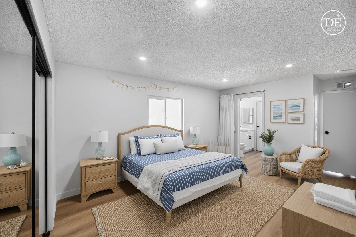 15181 Van Buren Boulevard, Unit 102 Riverside, CA 92504 - Photo 16 of 29 a bedroom with a bed and a couch
