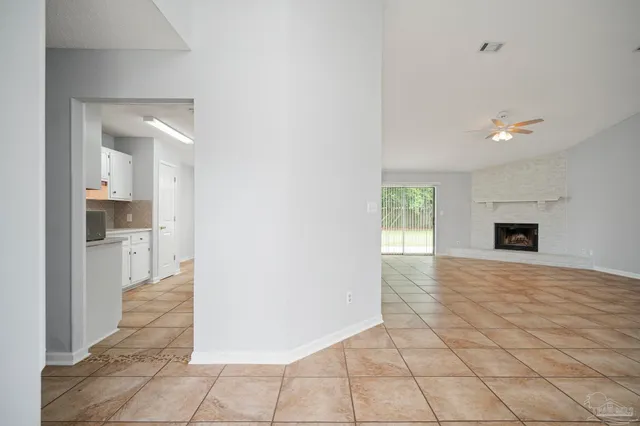 a view of a kitchen with a sink and a stove top oven