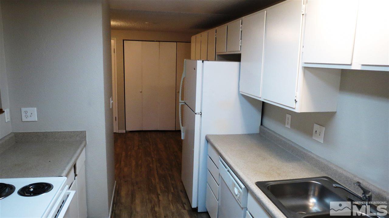 2015 Trainer Way Reno, NV 89512 - Photo 11 of 22 a kitchen with a refrigerator sink and stove