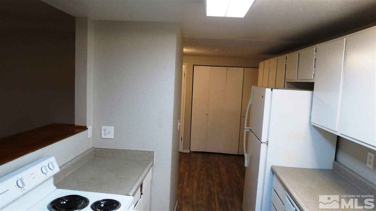 2015 Trainer Way Reno, NV 89512 - Photo 12 of 22 a view of a kitchen with a refrigerator a stove top oven a refrigerator and a stove
