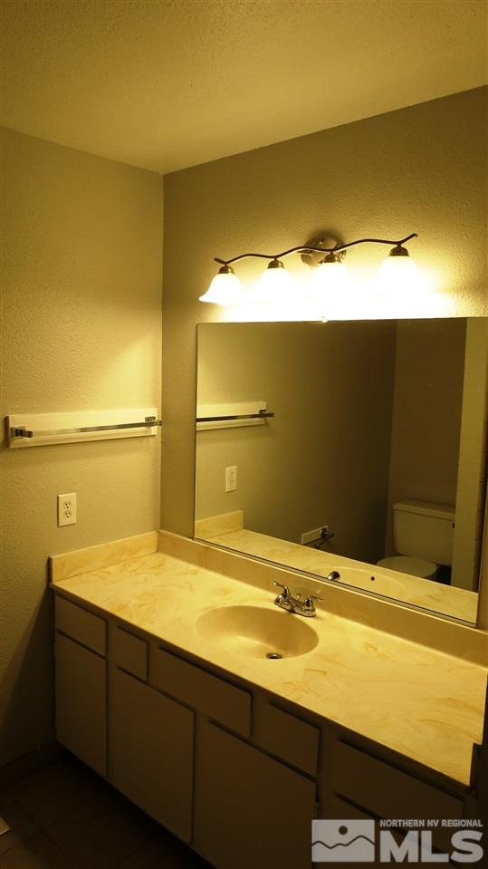 2015 Trainer Way Reno, NV 89512 - Photo 14 of 22 a bathroom with a sink and a mirror