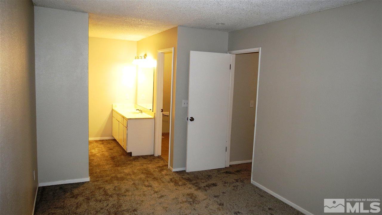 2015 Trainer Way Reno, NV 89512 - Photo 17 of 22 a view of a hallway with a refrigerator
