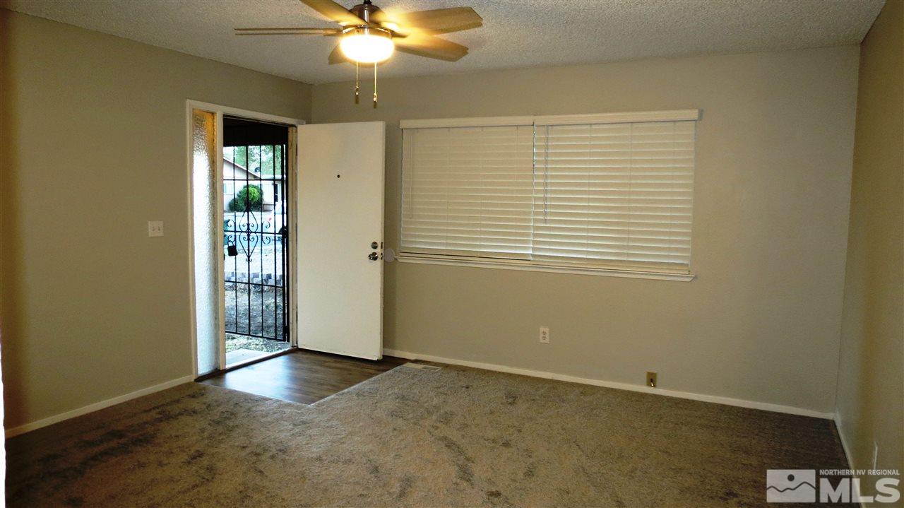 2015 Trainer Way Reno, NV 89512 - Photo 3 of 22 an empty room with windows and fan