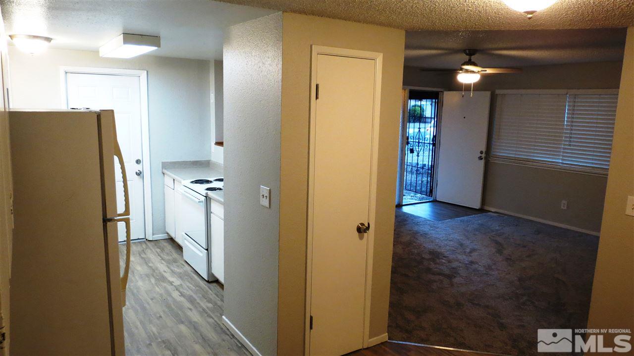 2015 Trainer Way Reno, NV 89512 - Photo 4 of 22 a view of hallway with wooden floor