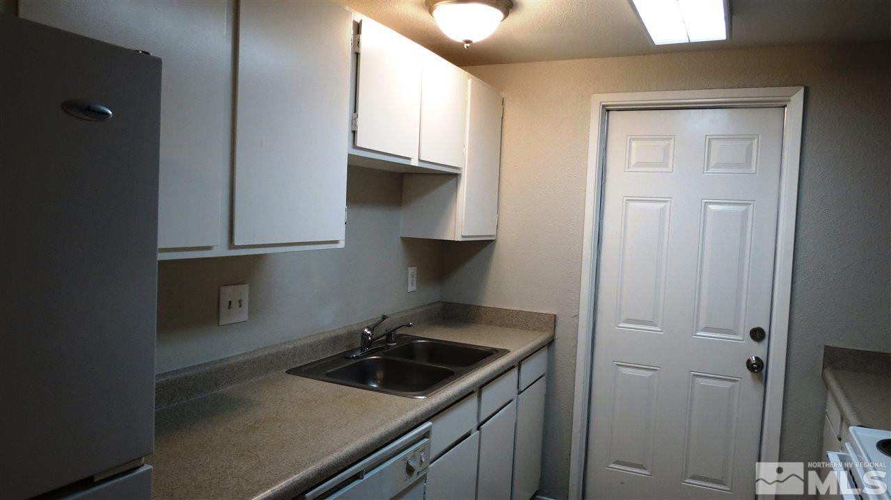 2015 Trainer Way Reno, NV 89512 - Photo 5 of 22 a kitchen with a sink stove and cabinets