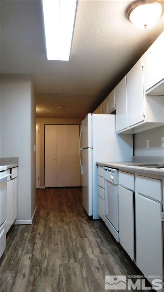 2015 Trainer Way Reno, NV 89512 - Photo 7 of 22 a view of a kitchen with white cabinets