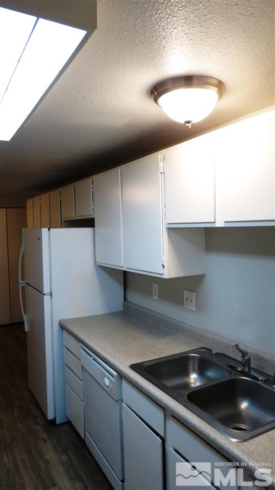 2015 Trainer Way Reno, NV 89512 - Photo 8 of 22 a kitchen with a refrigerator and a sink
