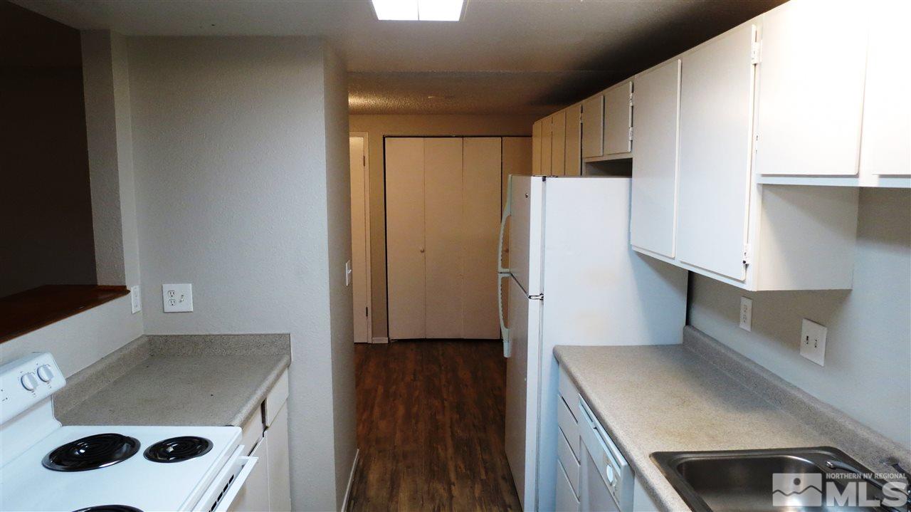 2015 Trainer Way Reno, NV 89512 - Photo 10 of 22 a kitchen with a refrigerator and a sink