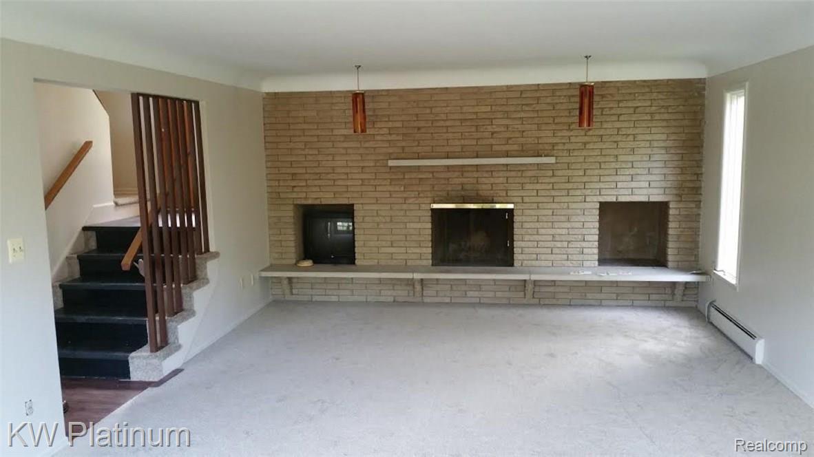 4648 Atkins Road North Street, MI 48049 - Photo 21 of 29 LIVING ROOM WITH NATURAL FIREPLACE