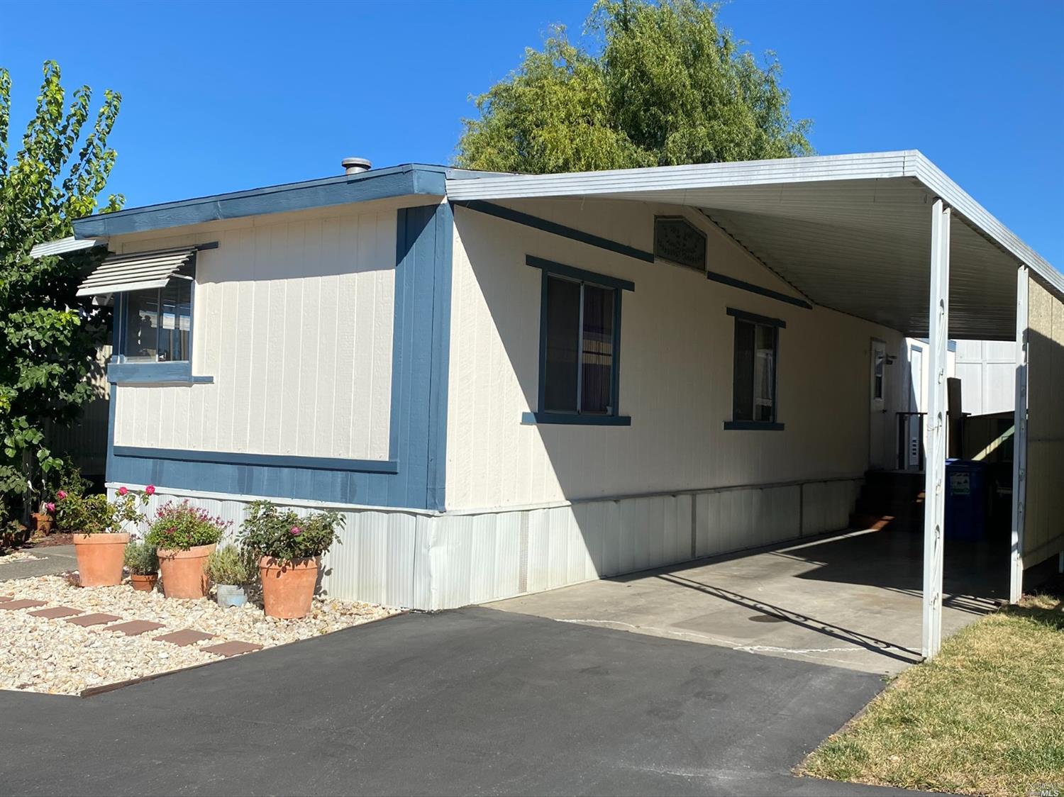 175 Apple Lane, Unit 175 Santa Rosa, CA 95407 - Photo 1 of 1 a side view of a house with a garage