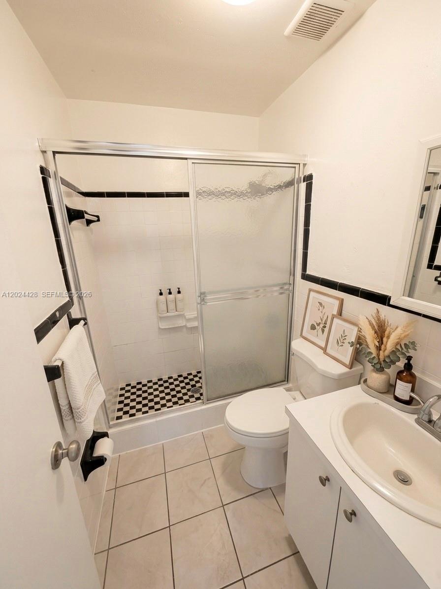 2745 West Okeechobee Road, Unit 39 Hialeah, FL 33010 - Photo 3 of 4 a bathroom with a sink toilet and shower