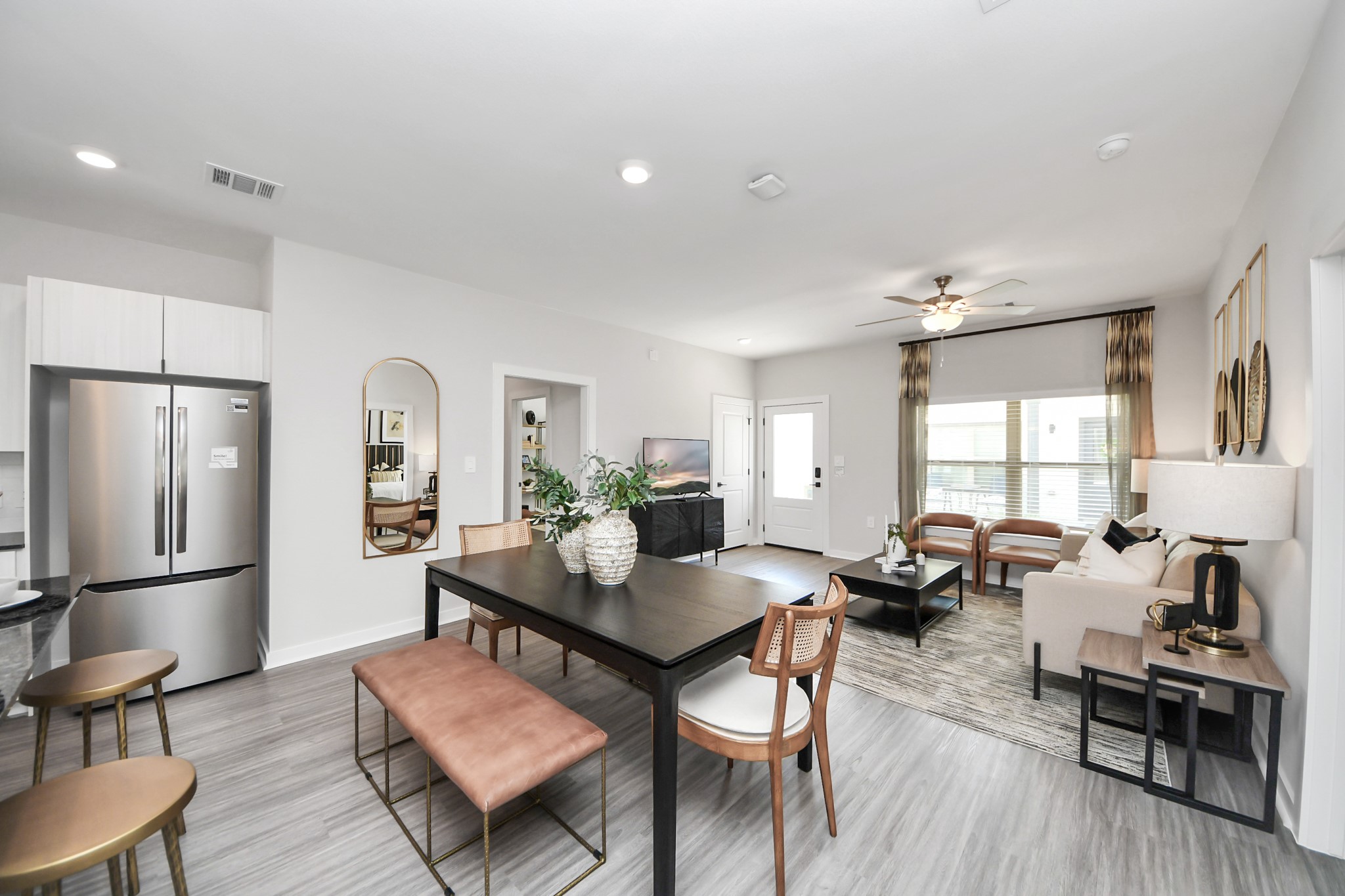 7711 Longmire Road, Unit 2 Conroe, TX 77304 - Photo 42 of 48 Boasting luxury finishes-stylish Island kitchen,granite counters,subway tile backsplash,ample custom cabinet space,stainless appliances,refrigerator,full size washer&dryer included,wood-like flooring throughout,open concept floor plan.